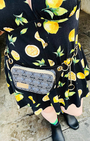lisa belt bag in black and white geometric with lemon print dress