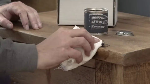 Adding wax to wooden surface