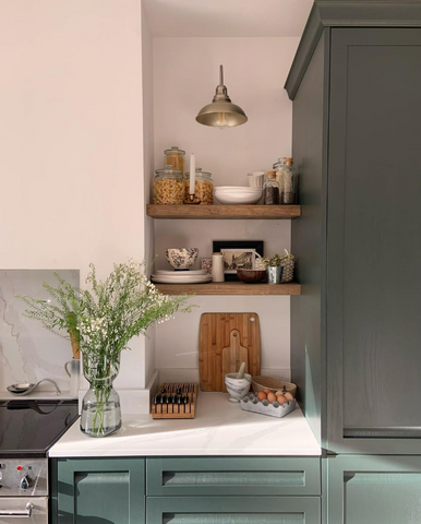Two shelves with various kitchen accessories