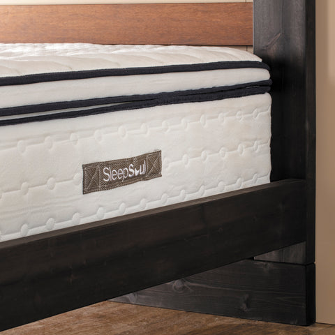 corner of a sleepsoul mattress showing the logo and pillow top