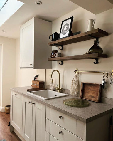 Wooden shelving adding additional storage in neutral,homely kitchen