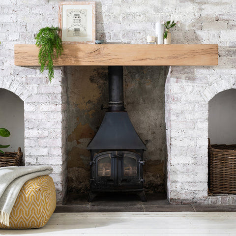 Mantel Beam above fireplace on stone washed wall