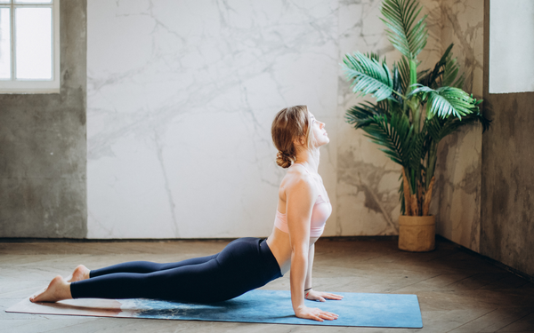 woman doing yoga as a calming activity 