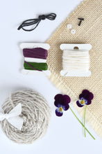 Load image into Gallery viewer, Image shows what&#39;s included with mislaird crochet bunny kit with purple flower
