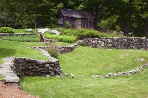 The stone wall behind stonehurst, headquarters for Vermont Woods Studios
