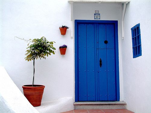 What does a blue front door symbolize?