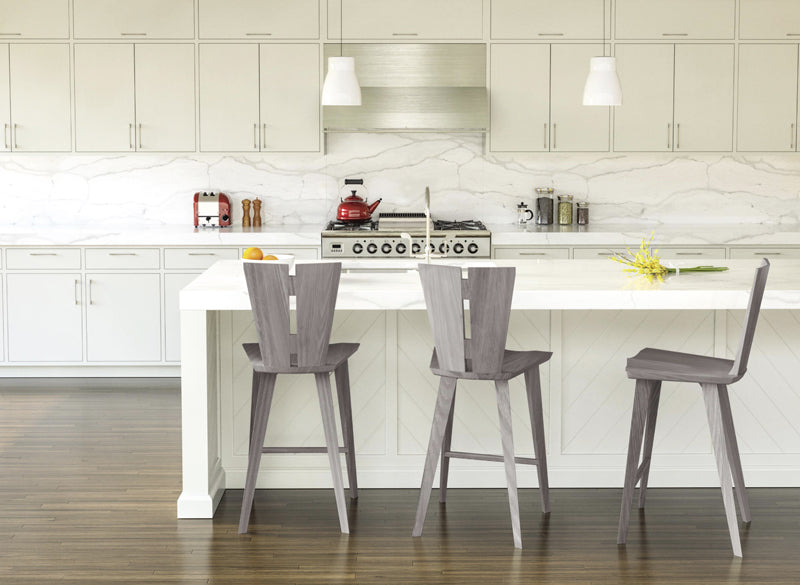 These Axis counter stools, shown in weathered ash provide a comfy perch where you can enjoy the serenity of this modern kitchen.