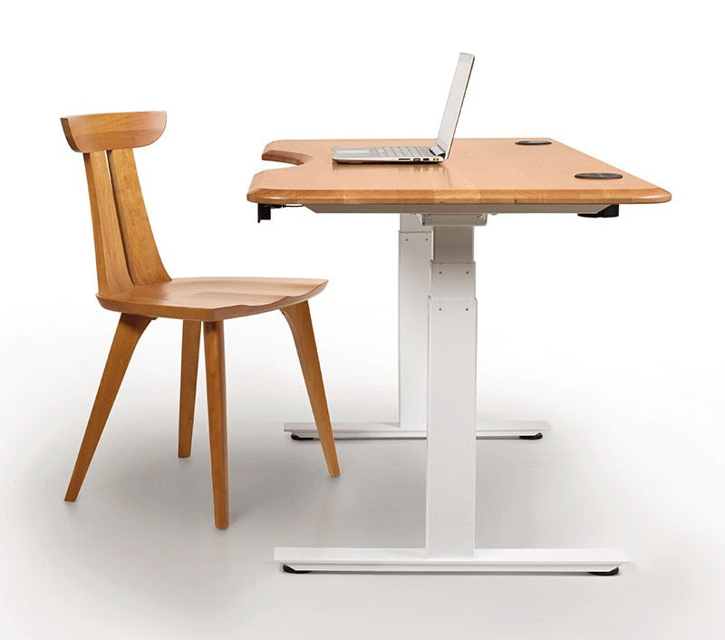 Adjustable height Invigo standing desk in solid cherry, walnut or ash wood. Shown in natural cherry.