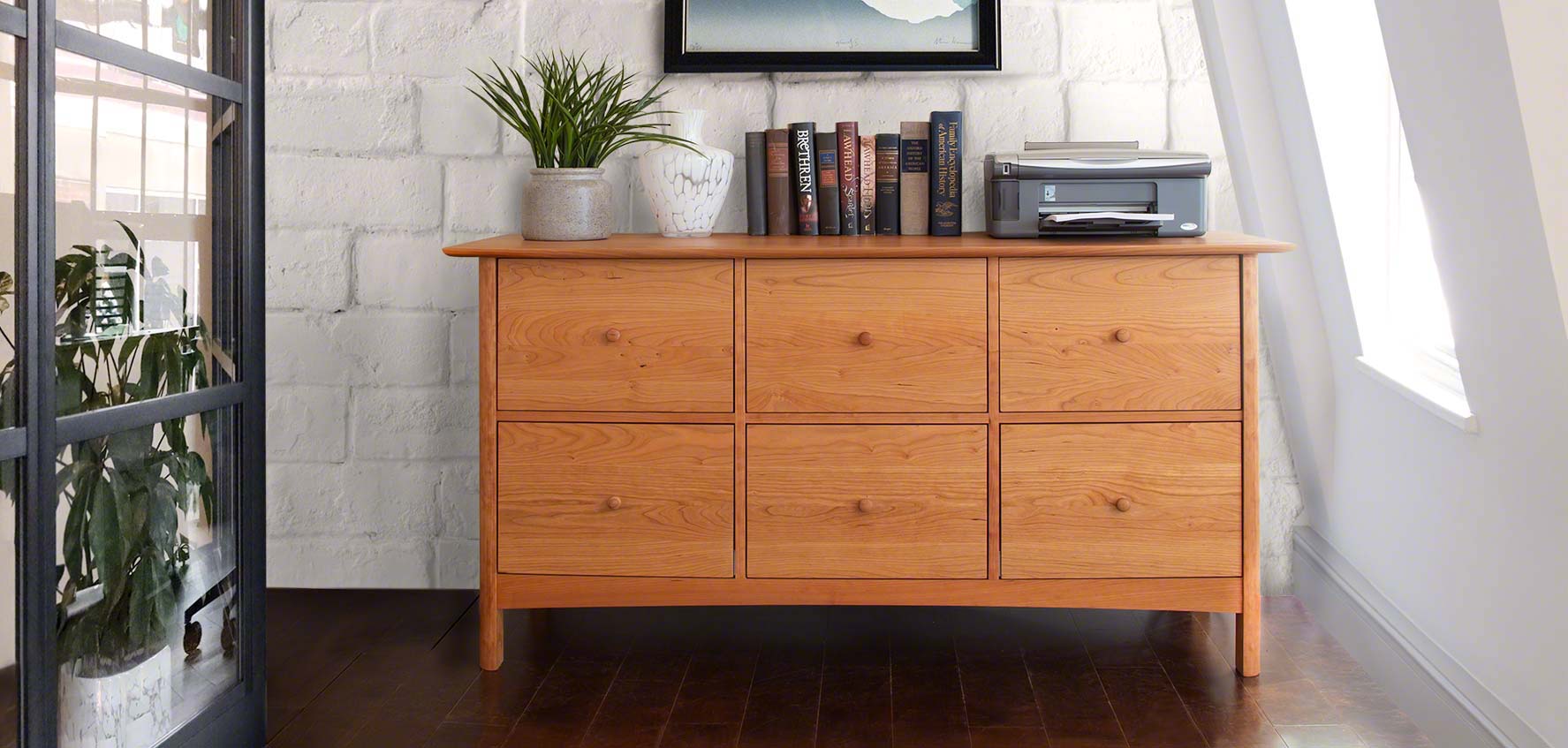 Modern Shaker Filing Cabinet with Plants, Natural Sunlight, hardwood floors, and clay pottery