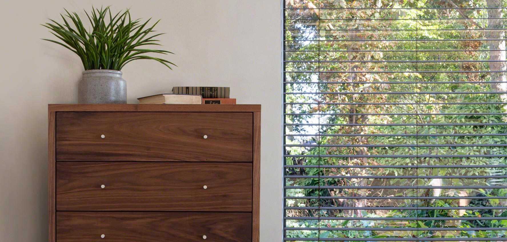 Larssen Chest in solid walnut with plants and window