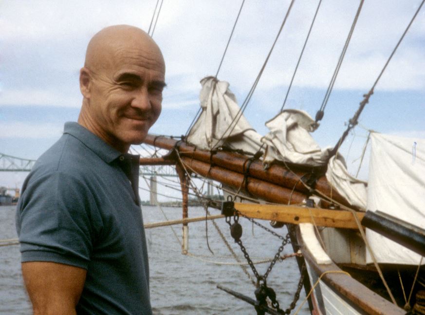 Adrian Pearsall stands in front of one of his sailboats