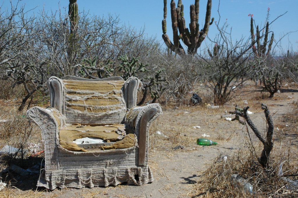 An old chair left in the desert to rot