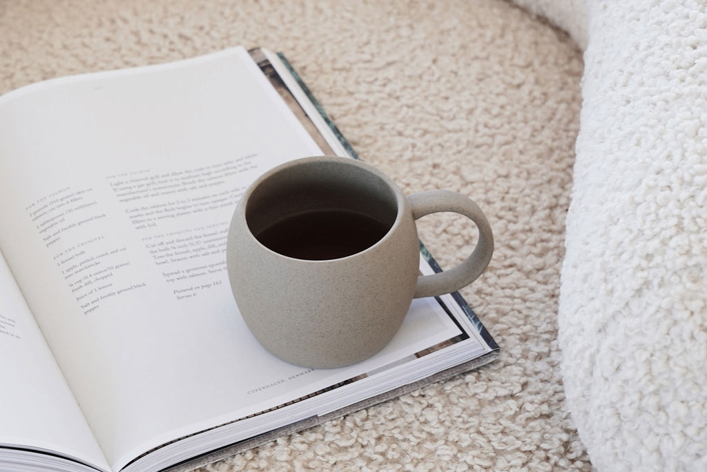 mayde tea mug on couch with magazine