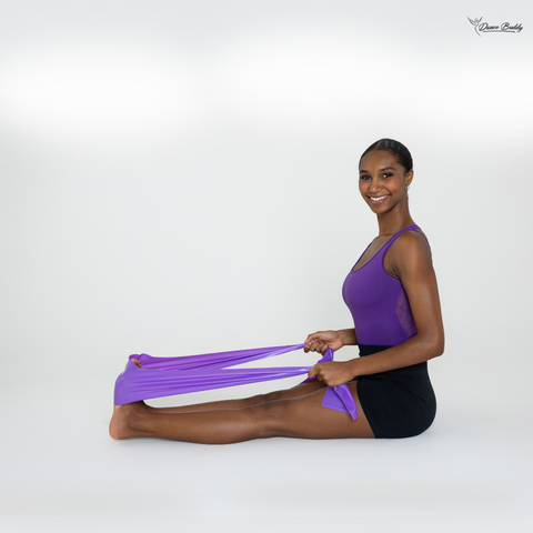 Dancer exercising with resistance band