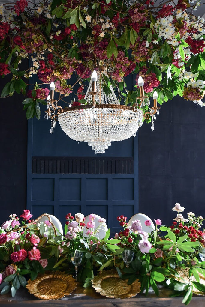 wedding decor trends for 2023 classic chandelier, crystals and tableware