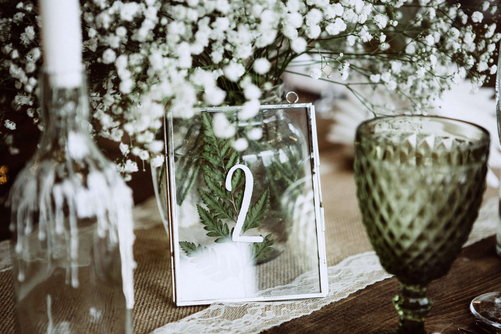 Rustic Chic Barn Wedding table number in glass frame with greenery