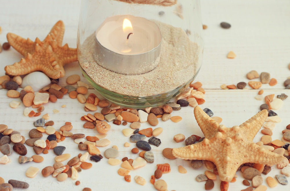 beach lantern with sand, rocks, seashells diy wedding lantern centerpiece ideas