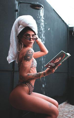 woman-holding-newspaper-shower-towel-young-attractive-influencer-lifestyle-hair-washing
