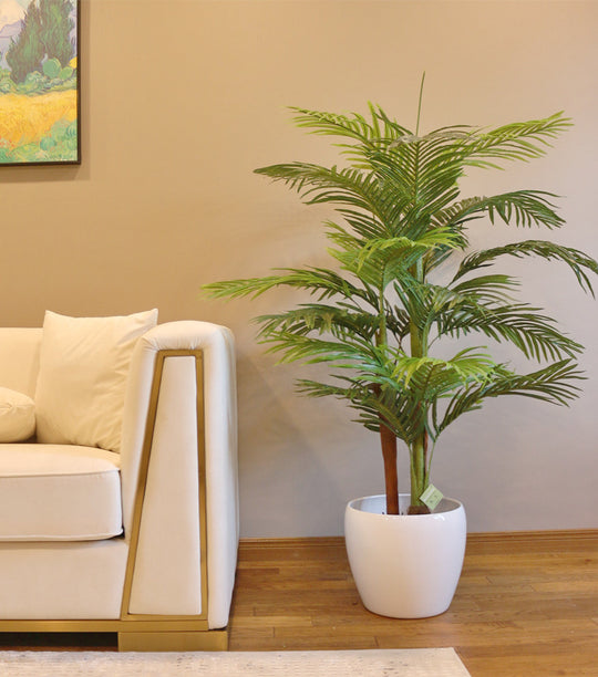 A beautiful artificial plant in a white pot