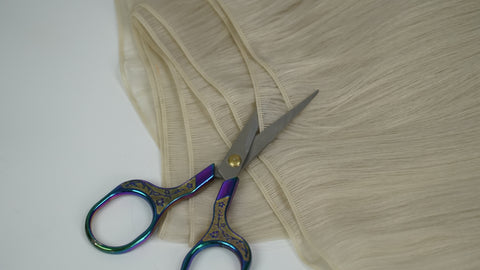 Genius weft extension being cut along the seams