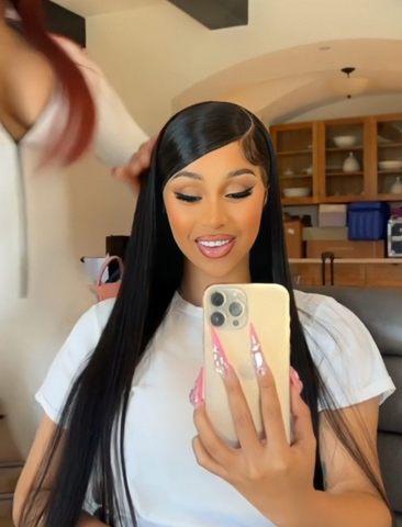 Cardi B with long black sleeked hair