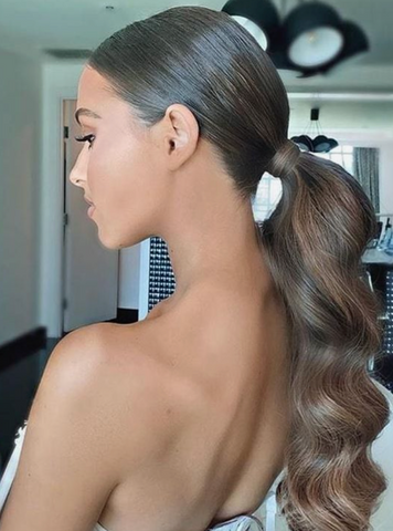 Women with wavy brown glamorous low ponytail