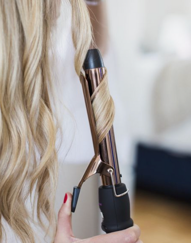 Hair being curled with curler