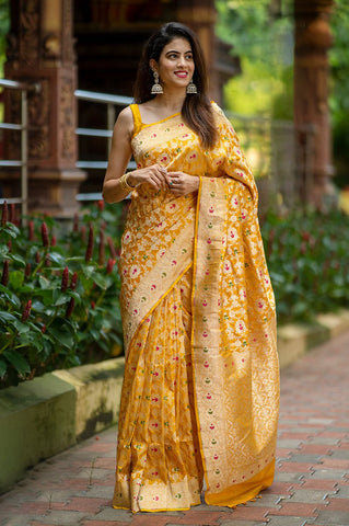 Indian women draped  beautifully Bright Yellow Meenadar Handwoven Banarasi Silk Saree by chinaya banaras