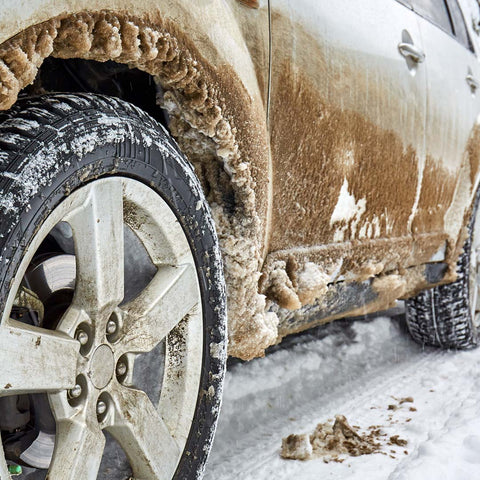 ice covered car going down the road