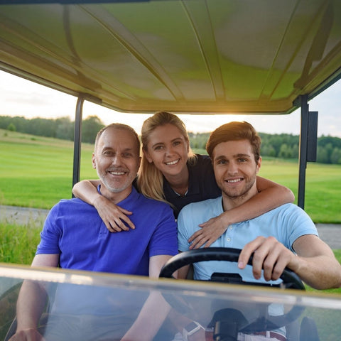 family in golf cart