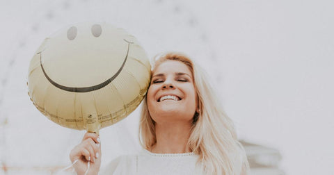 Happy woman with balloon