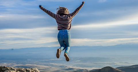 Girl jumping for joy of accomplishment