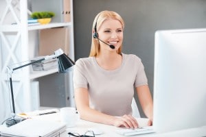 Saleswoman using a headset at work