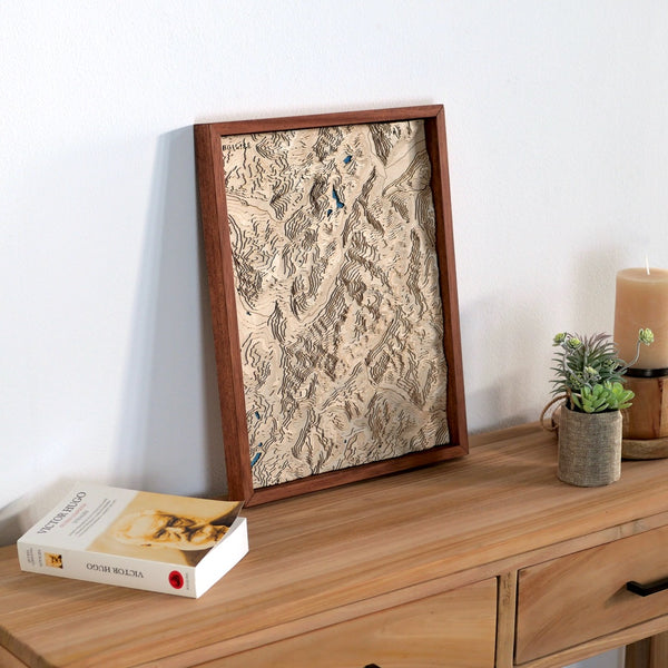 Topographic map of the Chamonix valley placed on a wooden chest of drawers