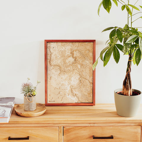 Wooden topographic map of Puy-en-Velay on wooden chest of drawers at the entrance to the living room