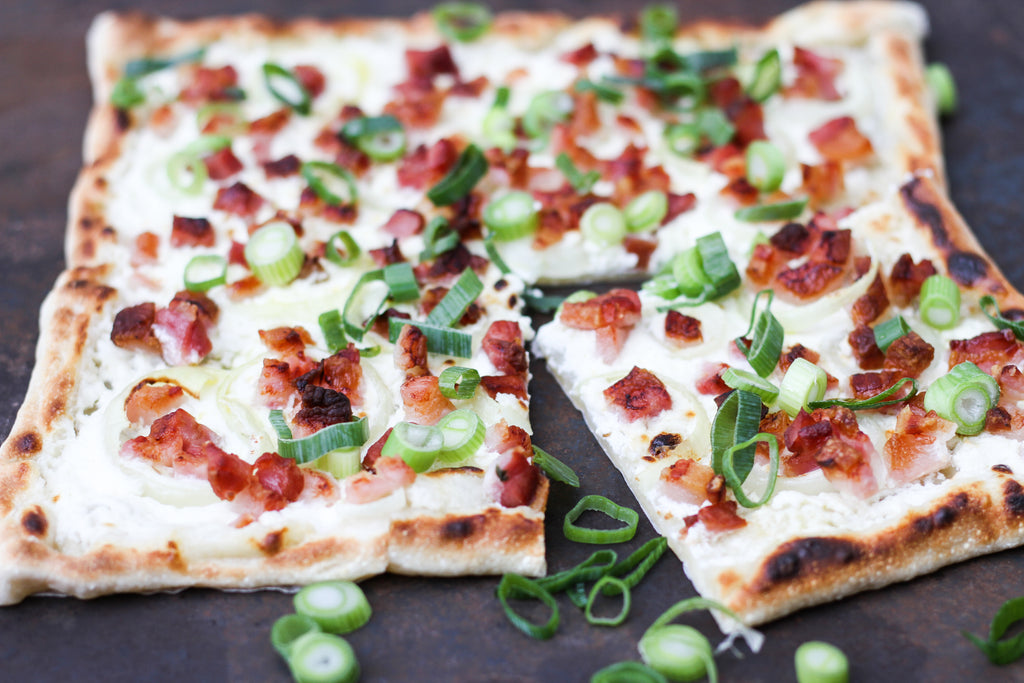 Tarte flambée with bacon and spring onion