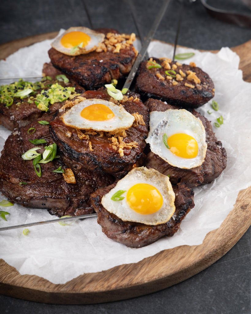 Several Steak Pops piled up on a plate