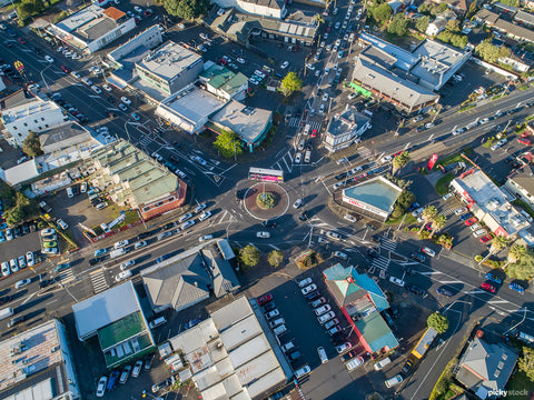 Graphic aerial image of roads merging on a suburban Auckland roundabout. 