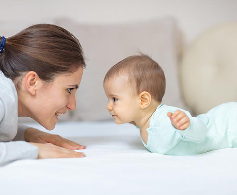 mom and baby tummy time play