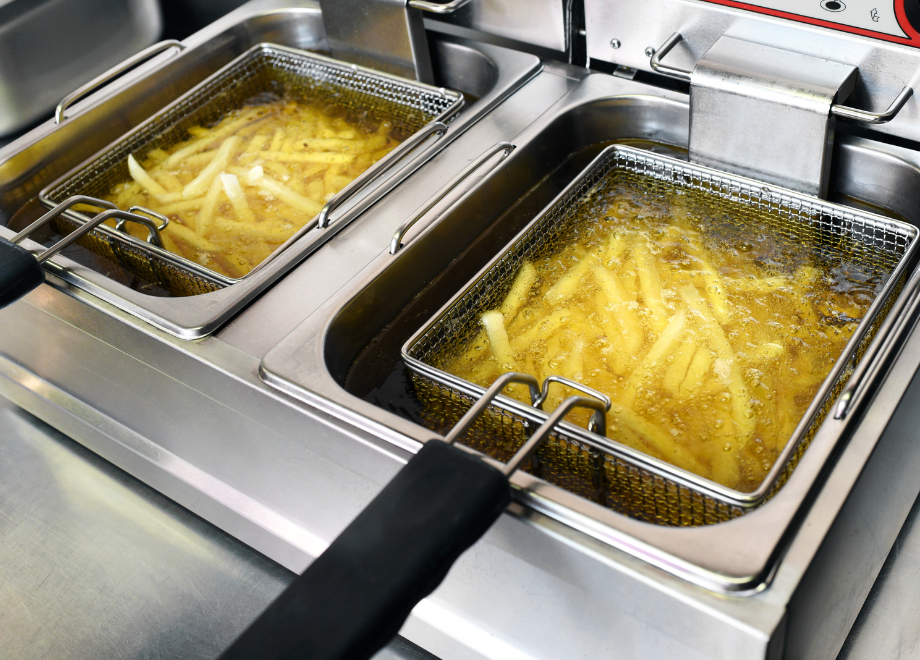 Fries deep frying in freshly filtered oil