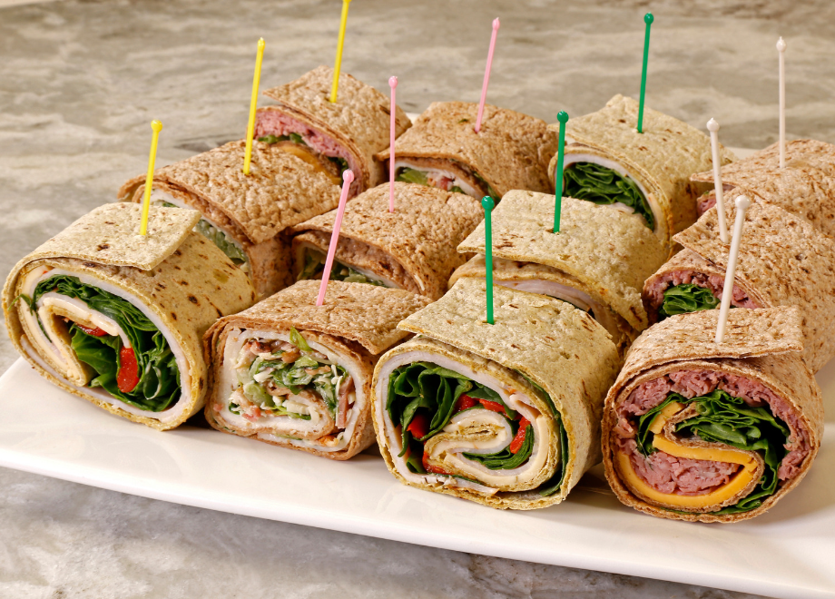 rolled wrap appetizers with food picks in them