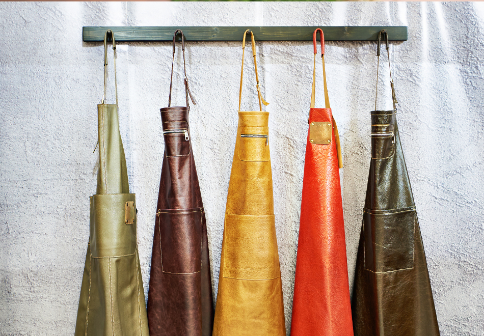 five aprons hanging up