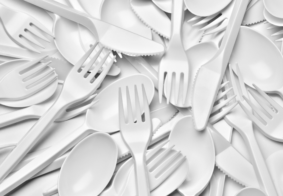 pile of disposable cutlery, disposable knives and disposable forks