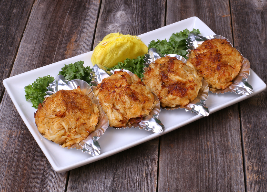 crab cakes on top of food shells