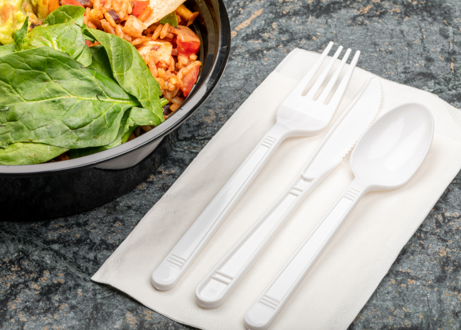 disposable dinner napkin with disposable cutlery on top