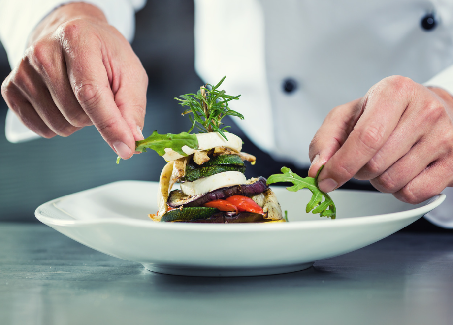 chef garnishing a dish