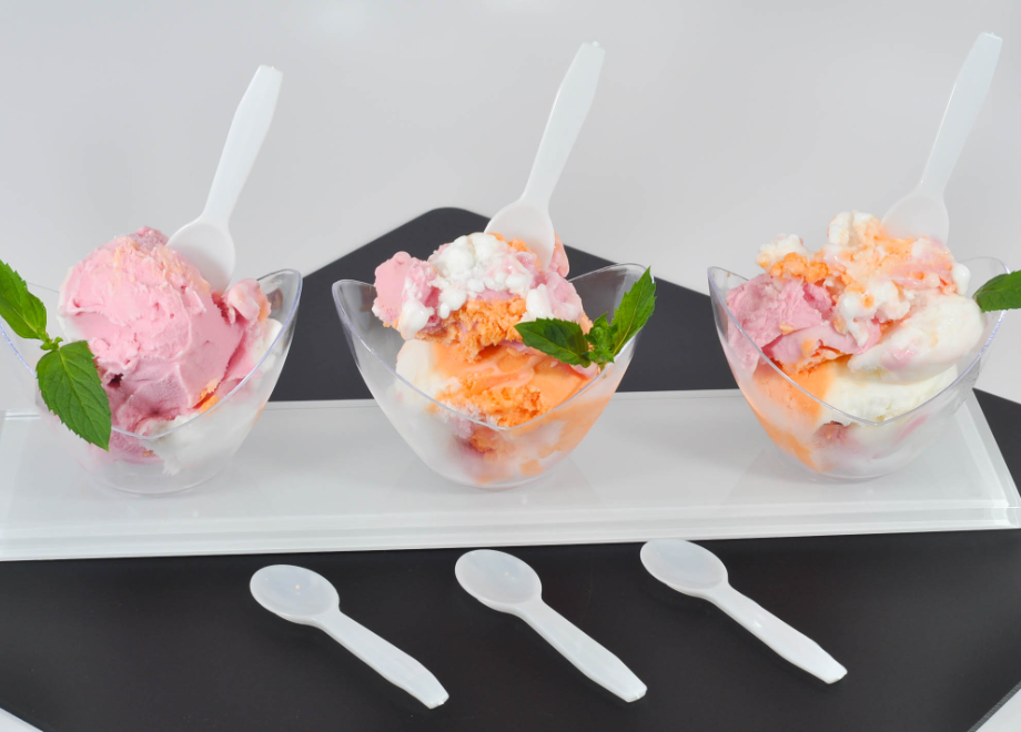 colorful ice cream with taster spoons in them