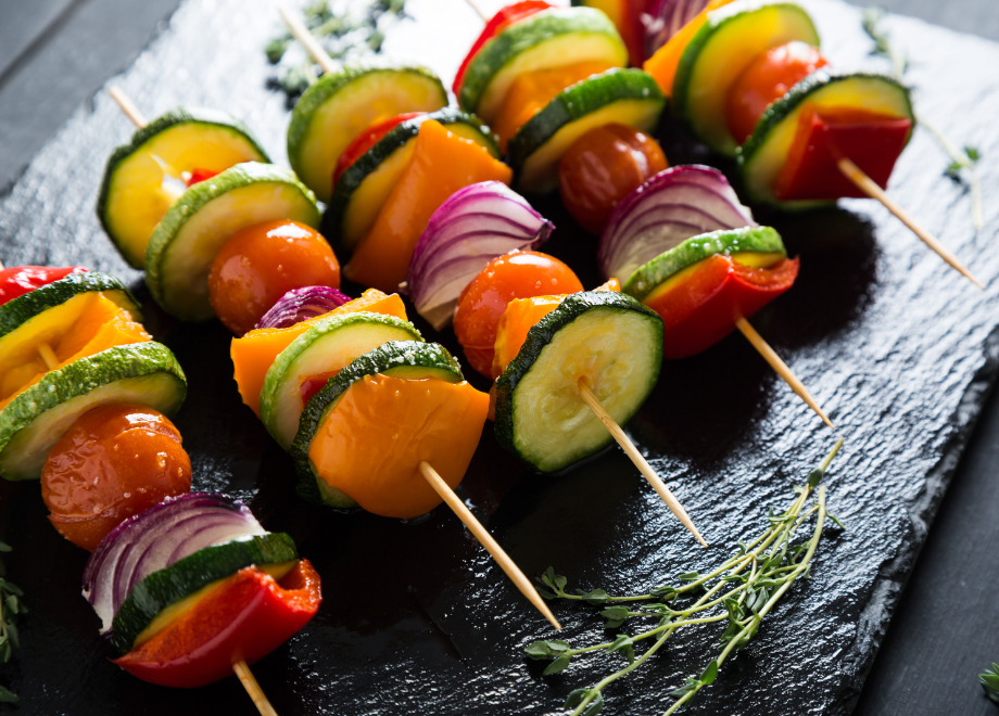 skewers with bright grilled vegetables on them