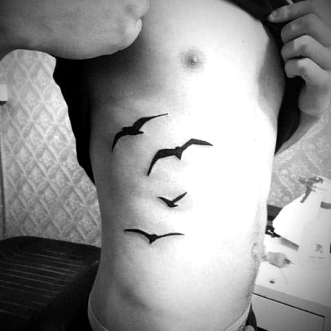 Bird Rib Tattoo