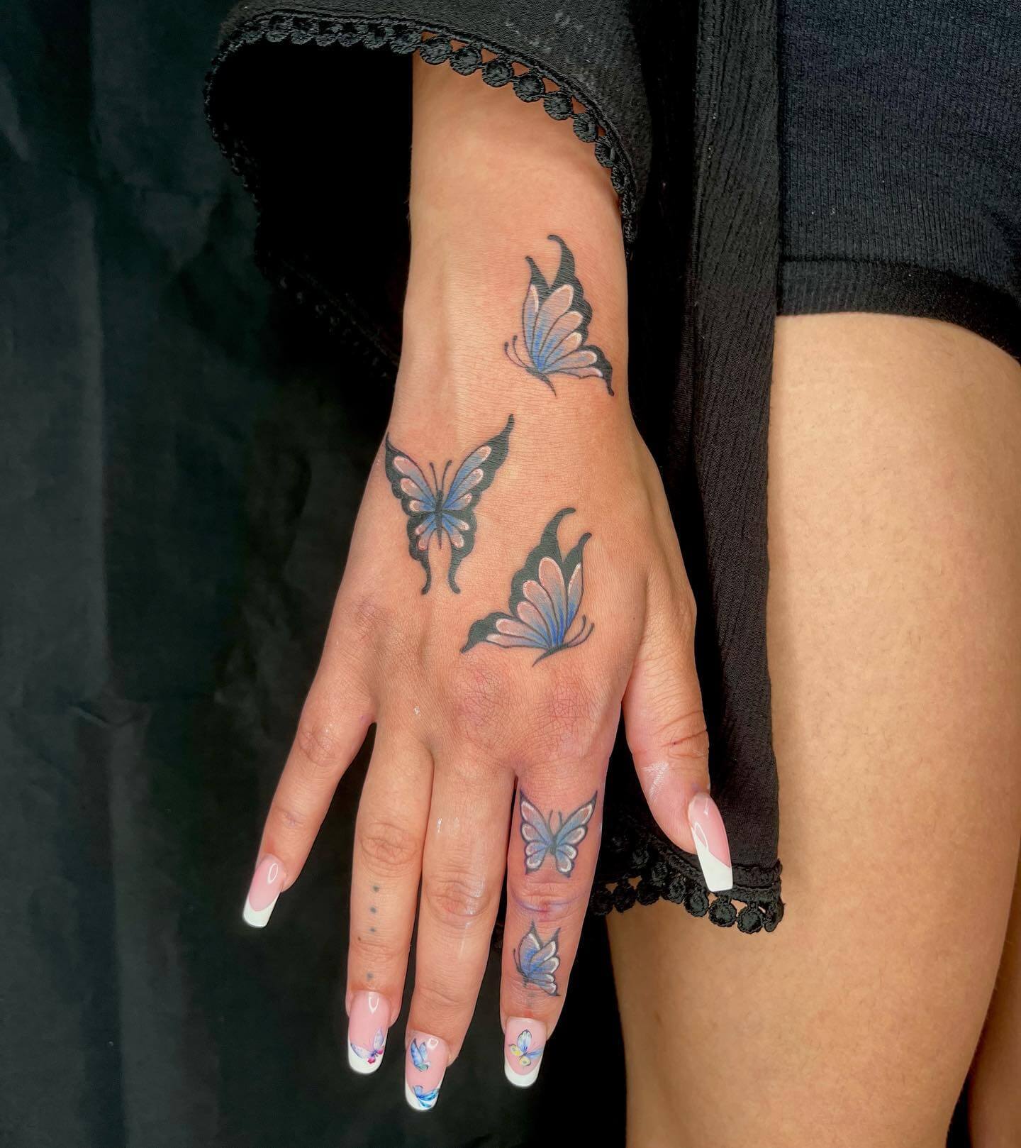 Blue Butterfly Hand Tattoo
